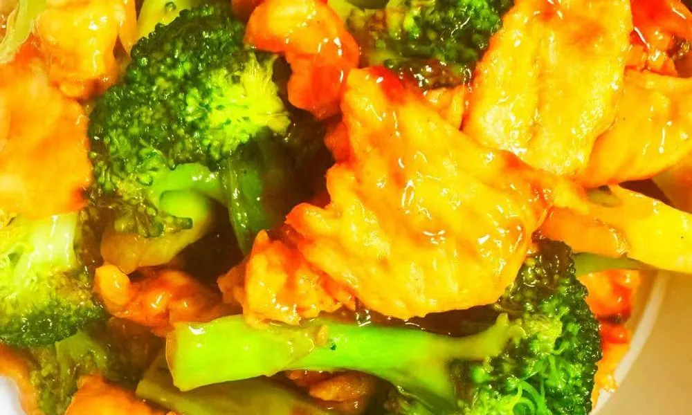 General Tso's Chicken Succulent chicken pieces and broccoli in a sweet and sour sauce at Double Delight, a Chinese Restaurant restaurant in Brooklyn